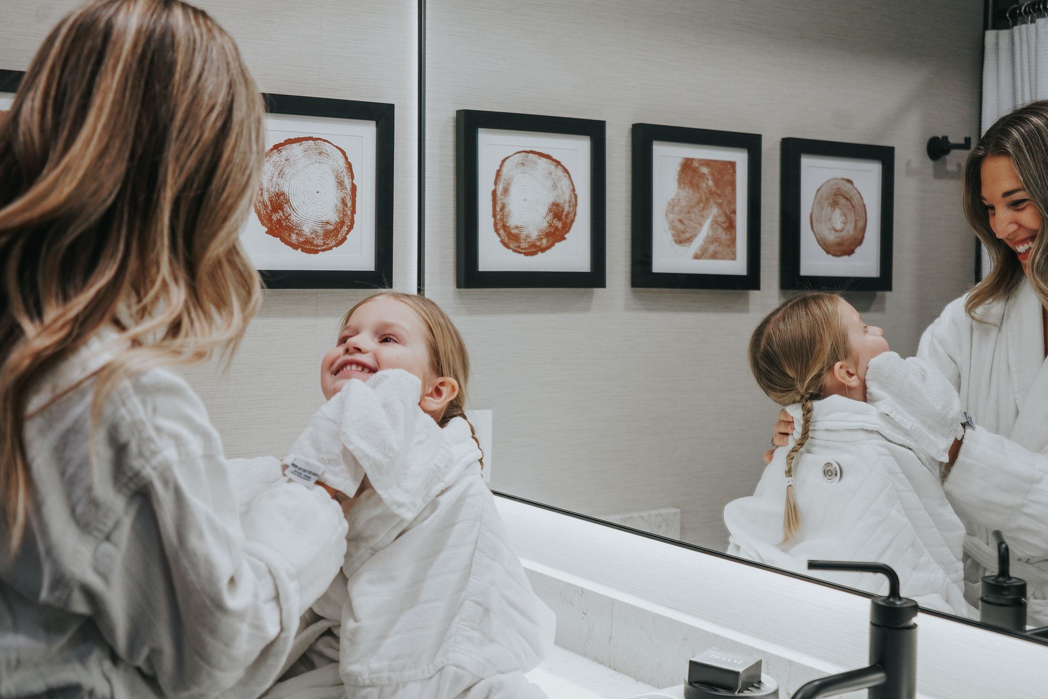 Mother and daughter wearing bath robes