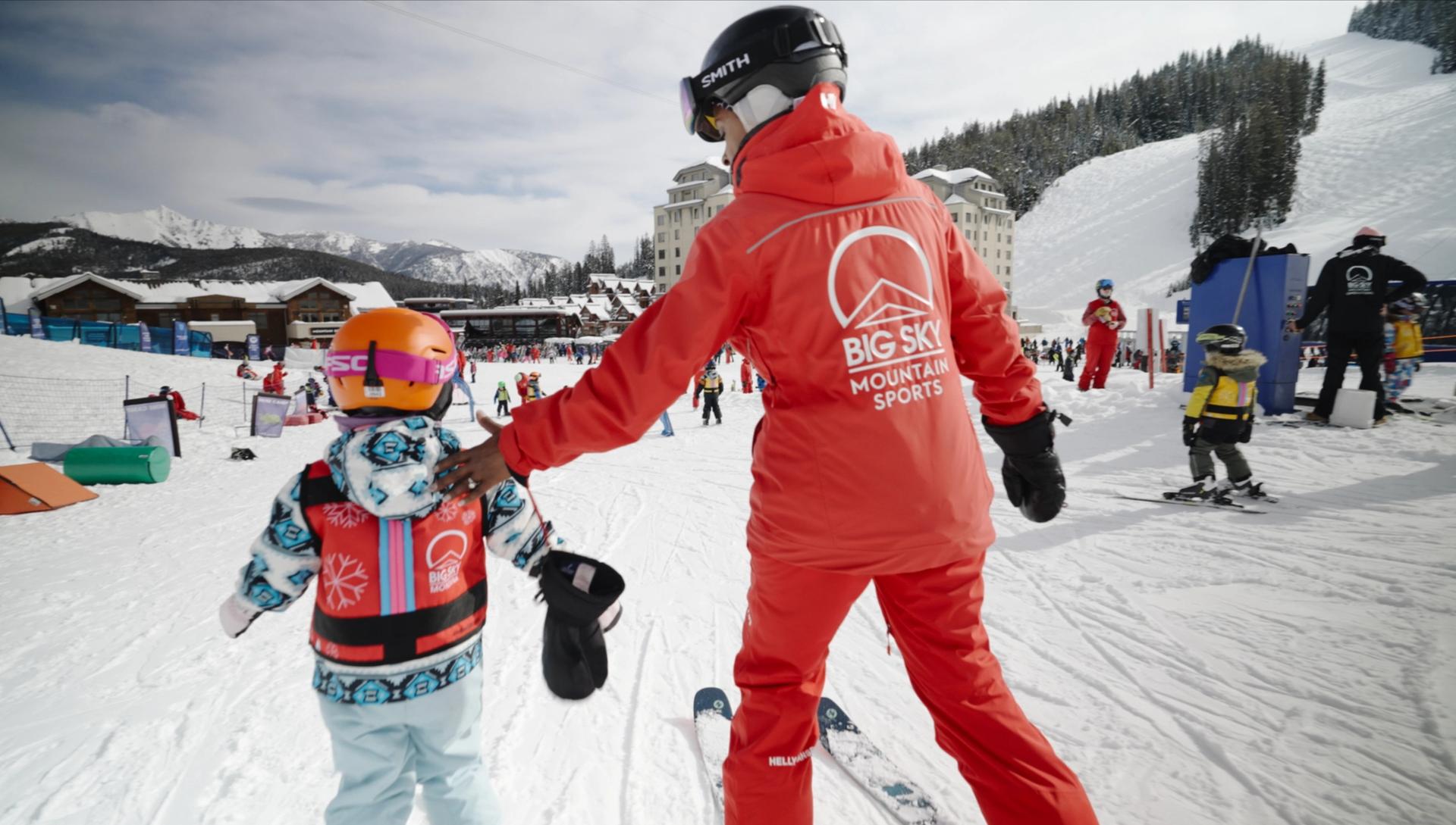 Carolyn helping a ski student