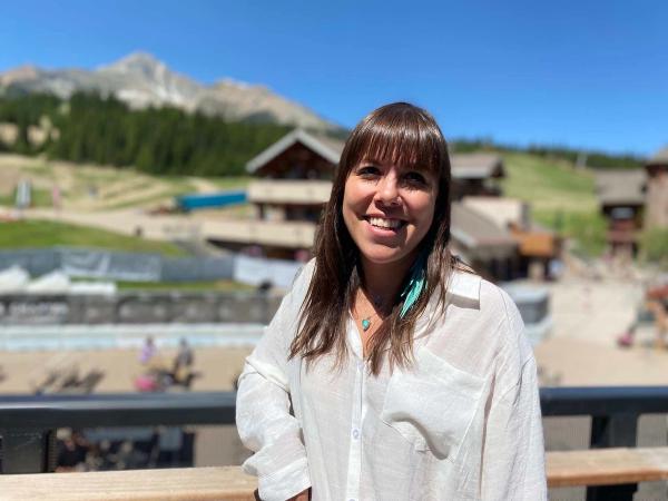 MJ stands at the top of vista deck on a summer day