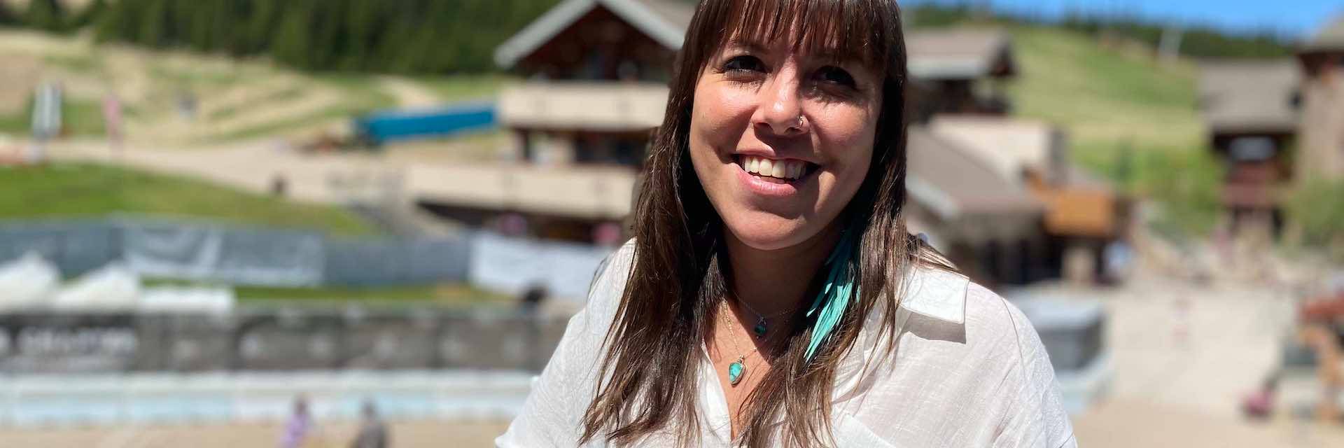 MJ stands at the top of vista deck on a summer day