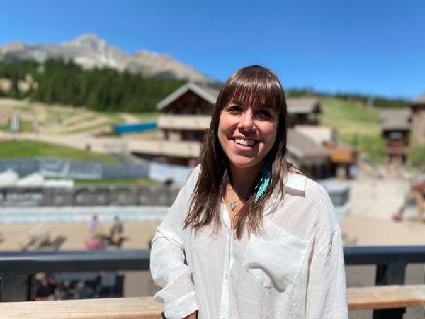 MJ stands at the top of vista deck on a summer day