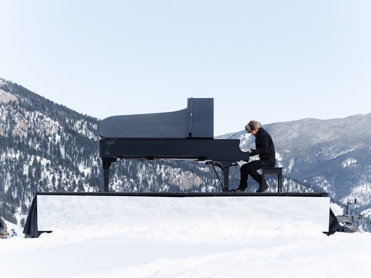 Piano player in a snowy landscape
