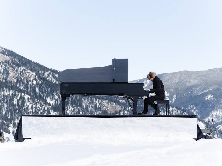 Piano player in a snowy landscape