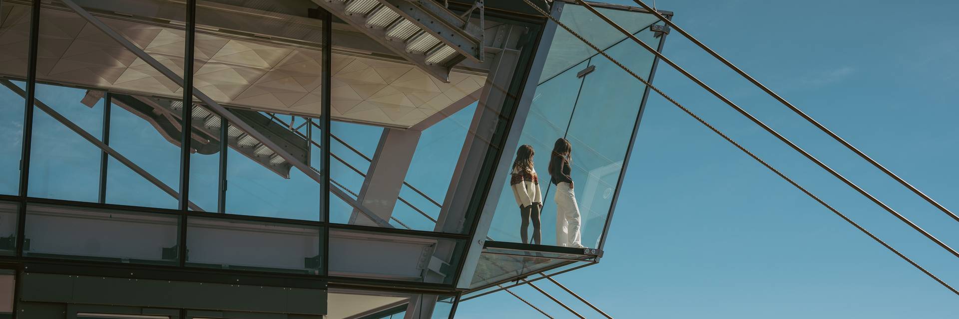 Two people standing on Kircliff's glass floor