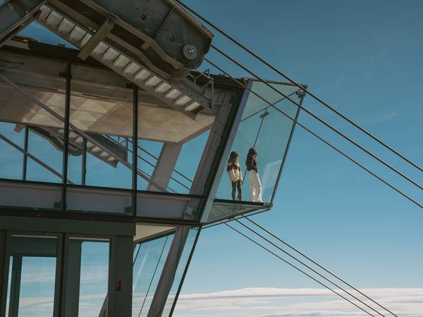 Two people standing on Kircliff's glass floor