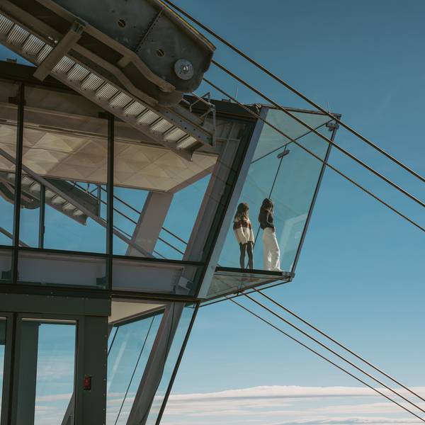Two people standing on Kircliff's glass floor