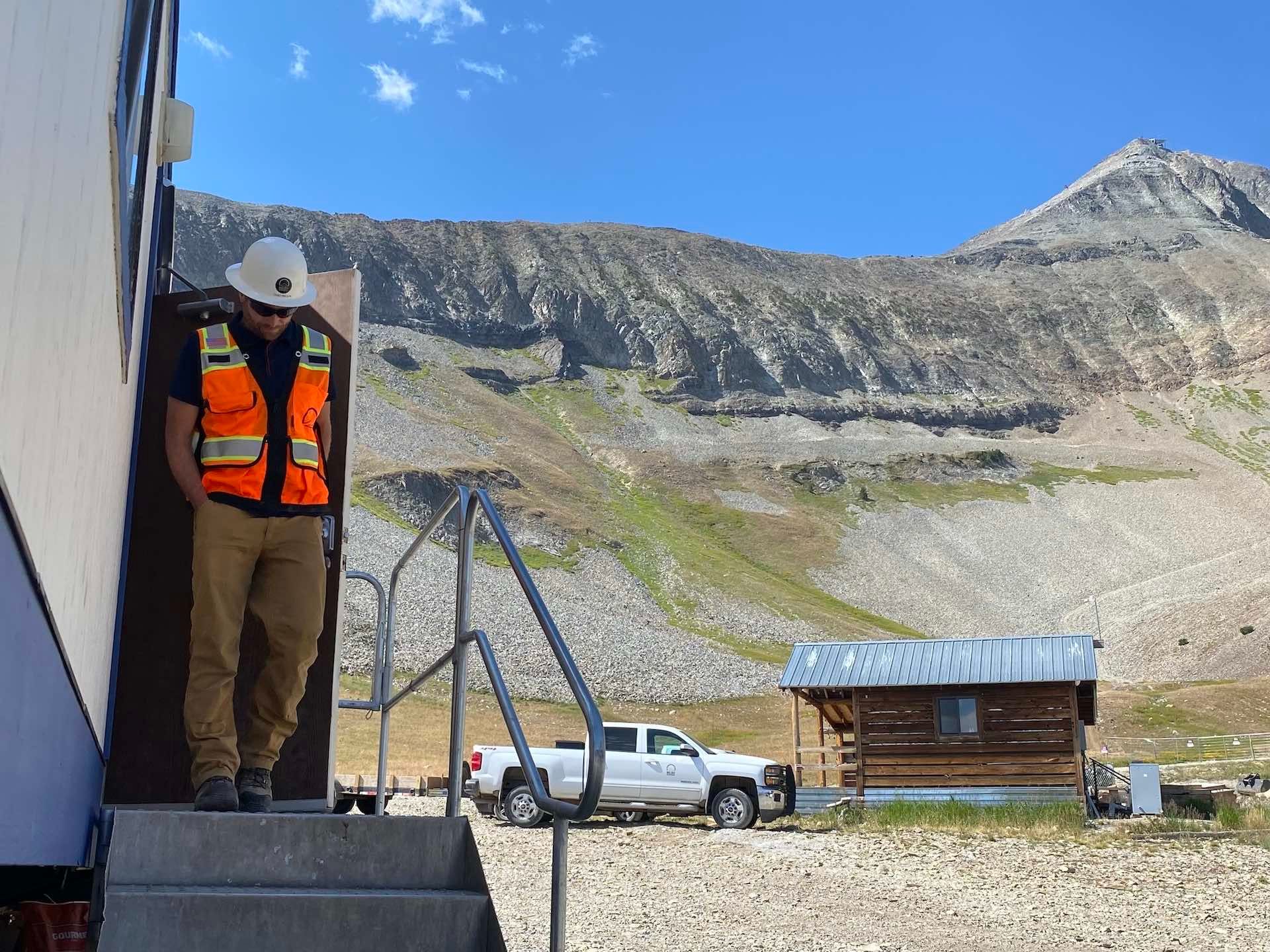 Chad walks out of a construction trailer near the new lower terminal