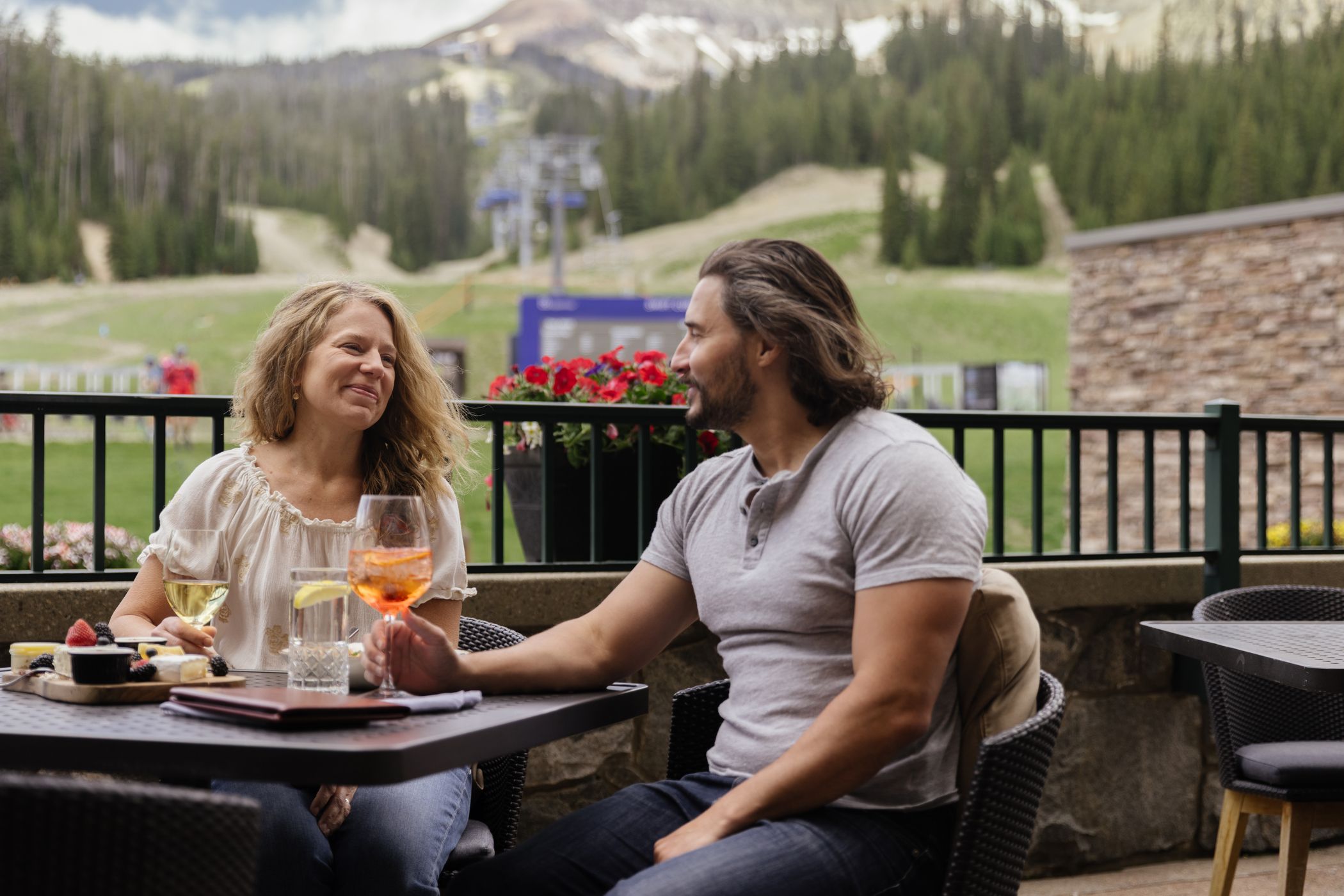 People on the patio at Carabiner Lounge in summer