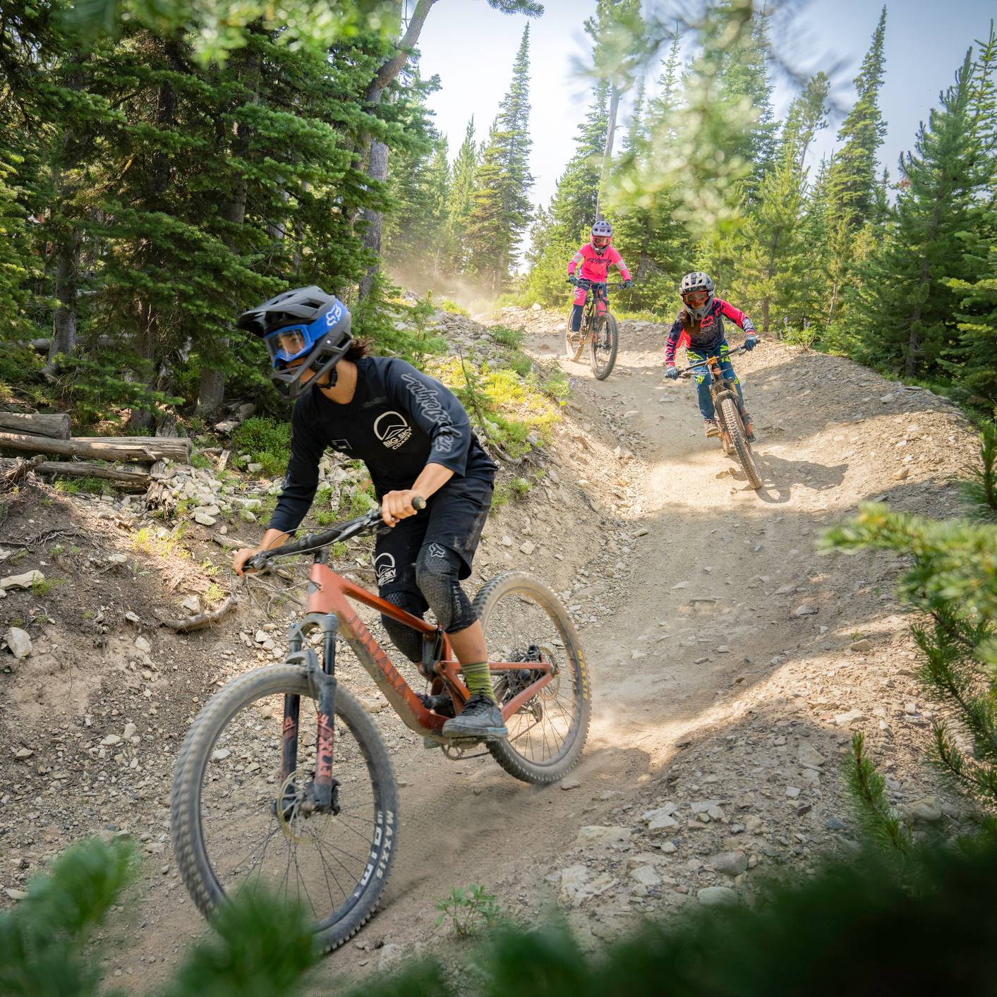 Mountain bike coach leading kids in a group lesson