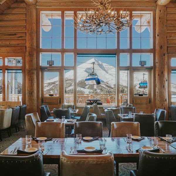 Group of skiers with food and drinks on Vista Deck