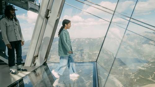 Girl walking out over the glass floor at Kircliff
