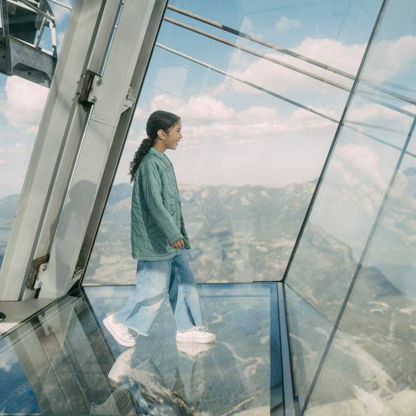 Girl walking out over the glass floor at Kircliff