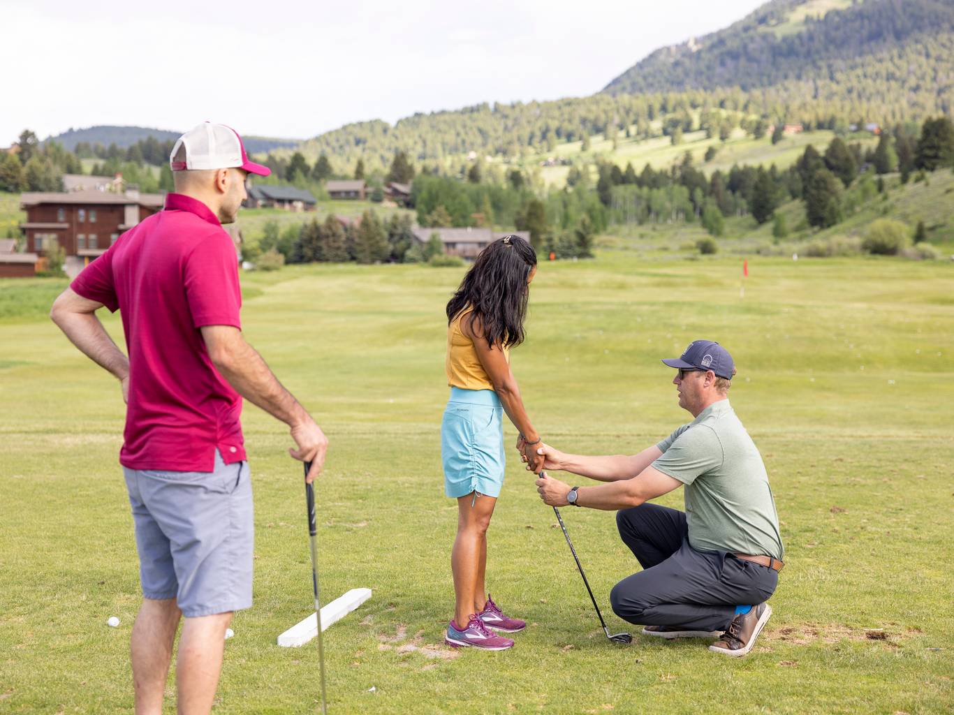 People in a golf lesson