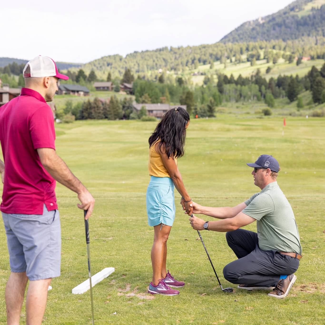 People in a golf lesson