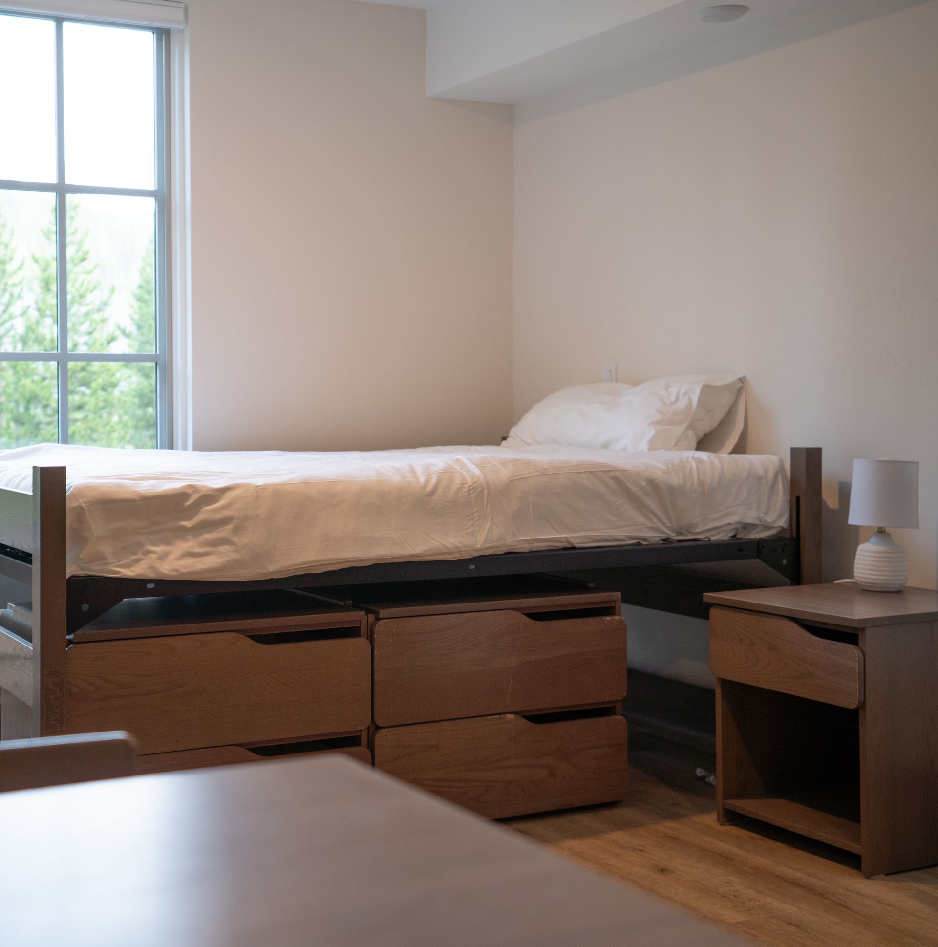 Bed in a workforce housing unit