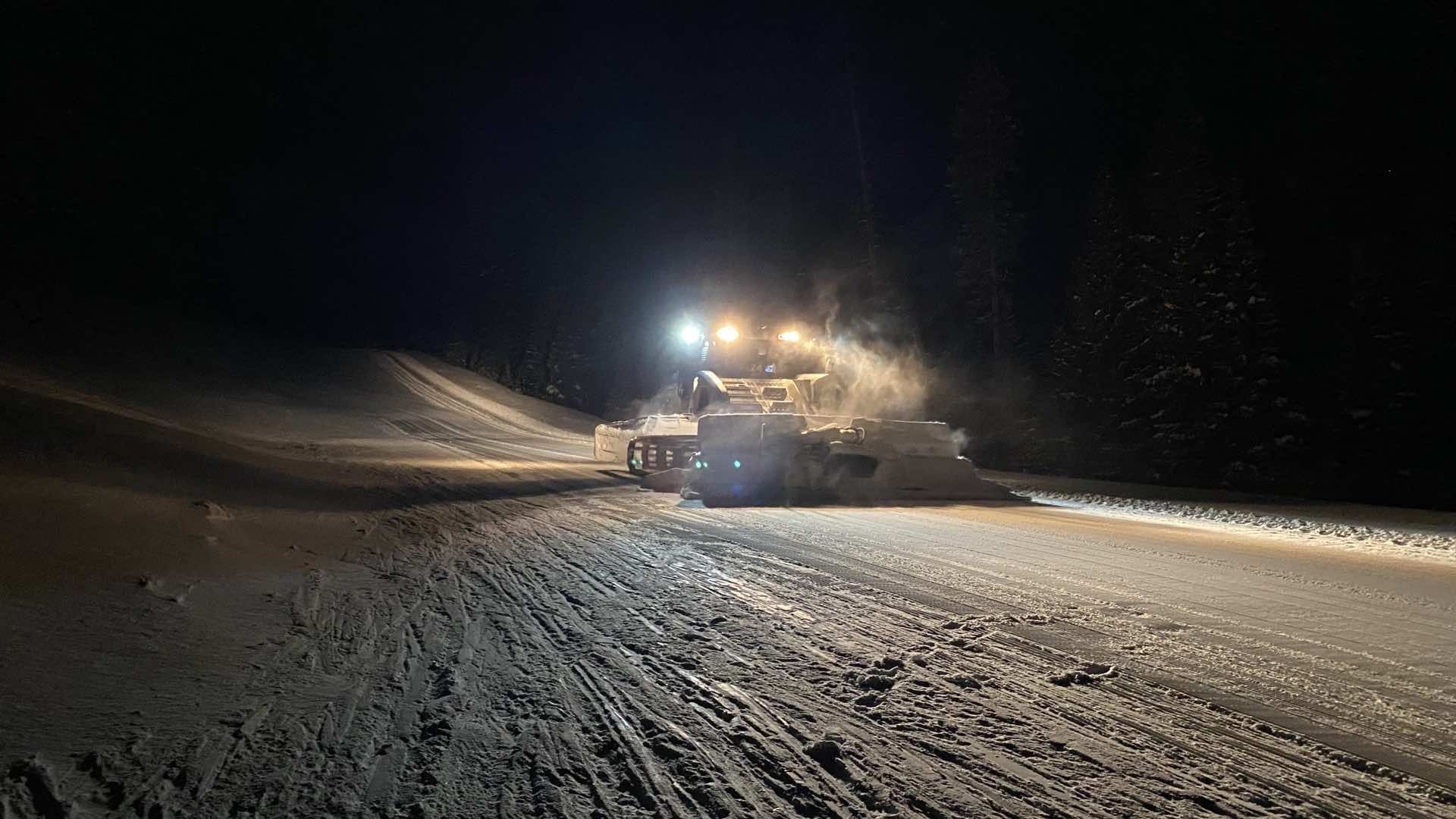 Ed drives the snow cat in the dark