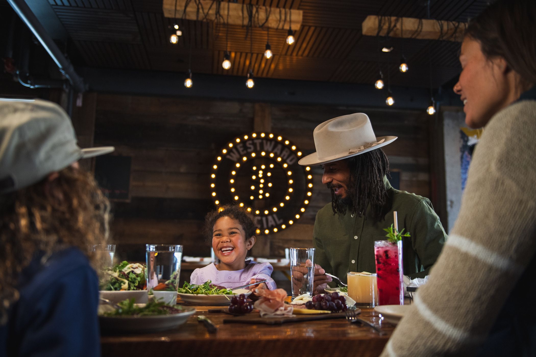 Family with food in Westward Social