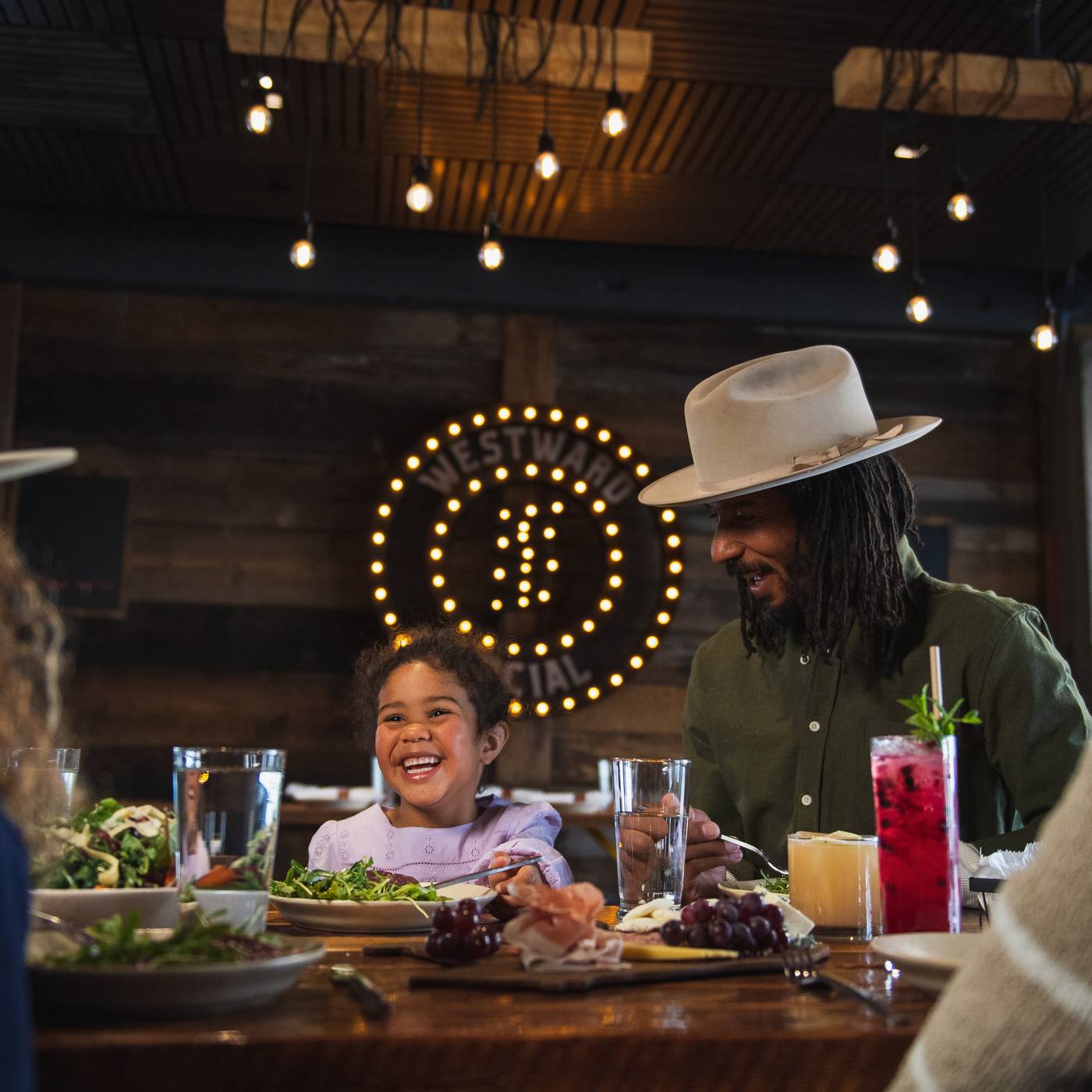 Family with food in Westward Social