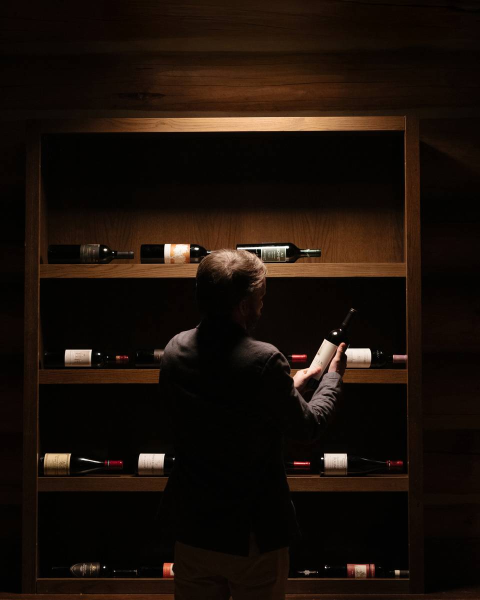 Sommelier holding a bottle of wine