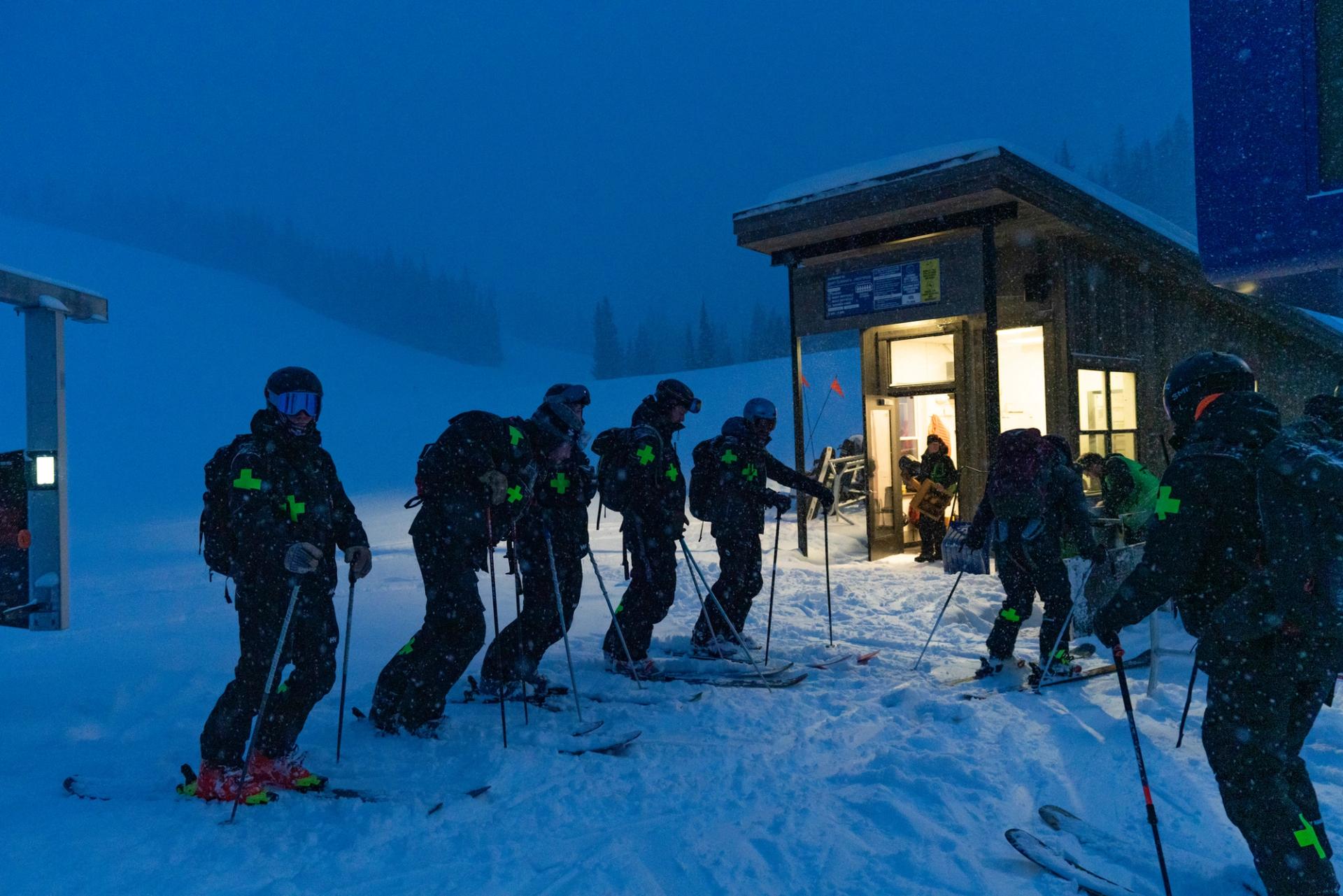 Ski Patrol loading Swifty in the dark to start snow mitigation