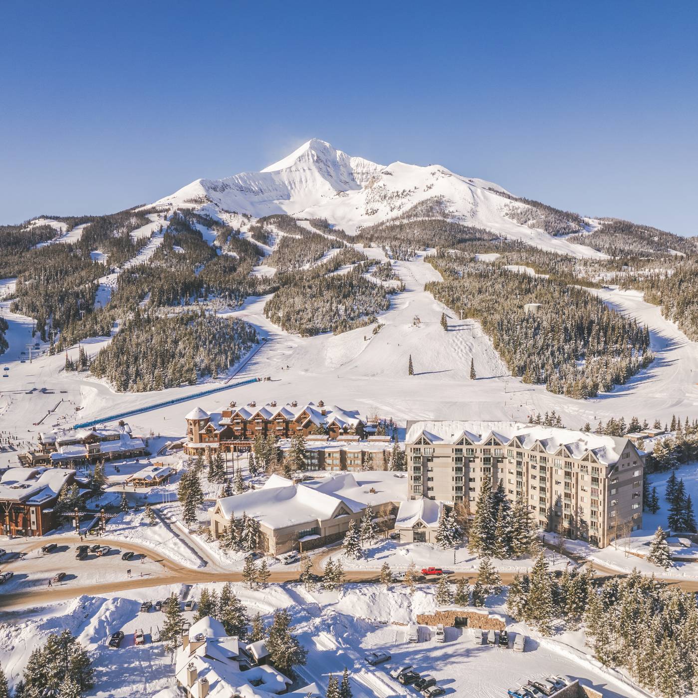 Big Sky Resort's Mountain Village in winter with Lone Mountain in the background