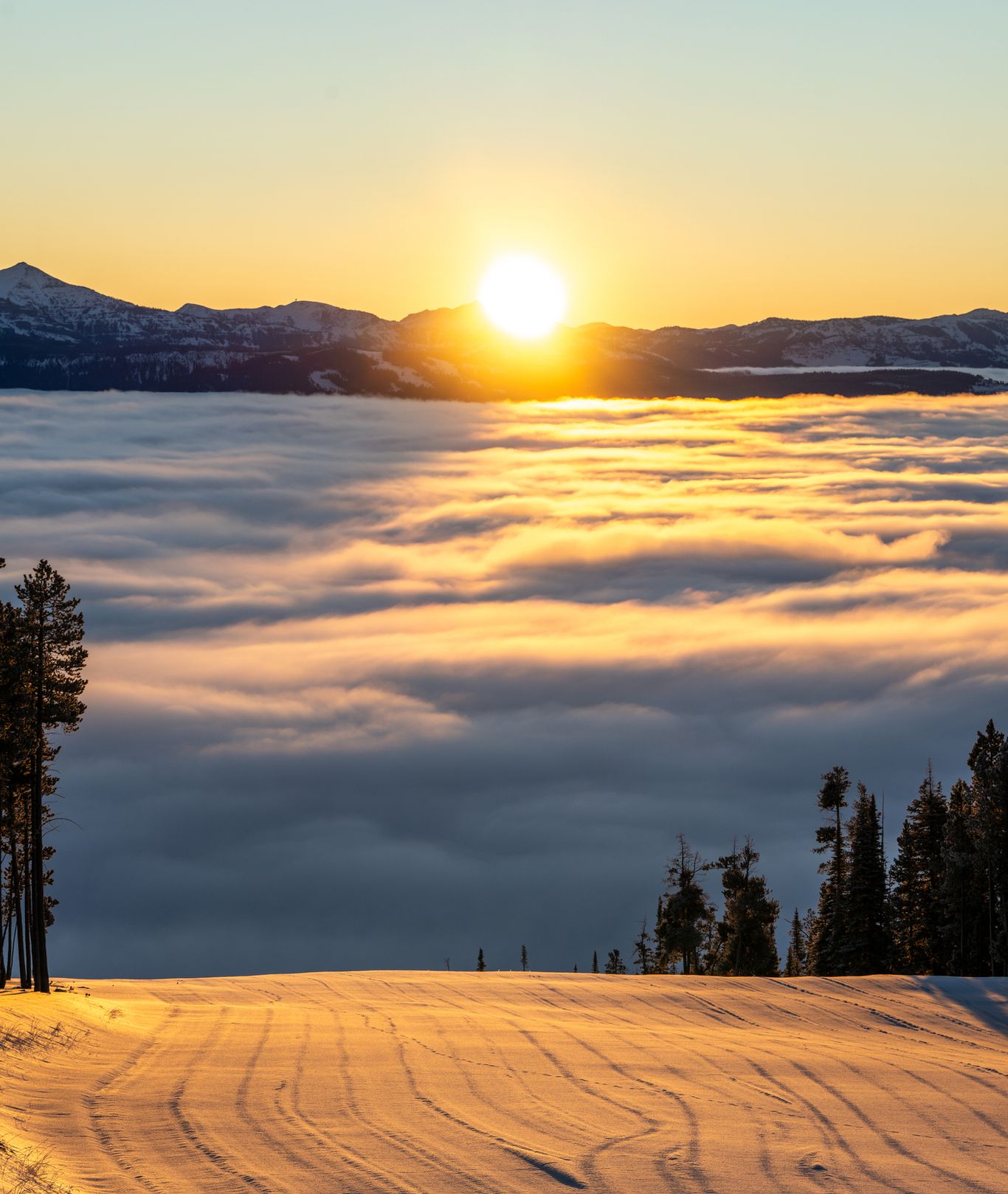 Sunrise over a groomed run