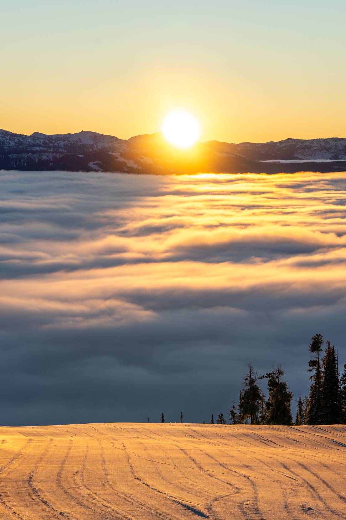 Sunrise over a groomed run