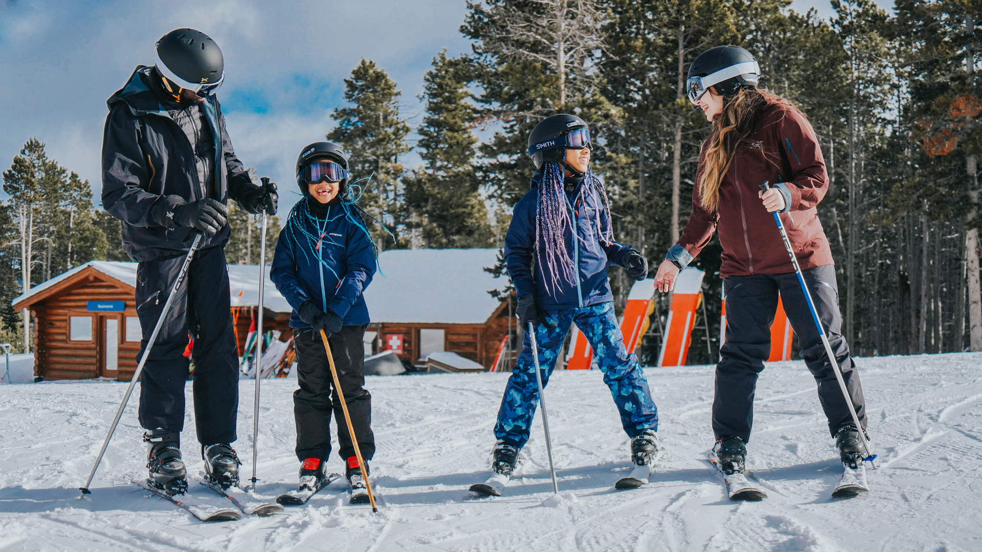 Family standing in ski gear