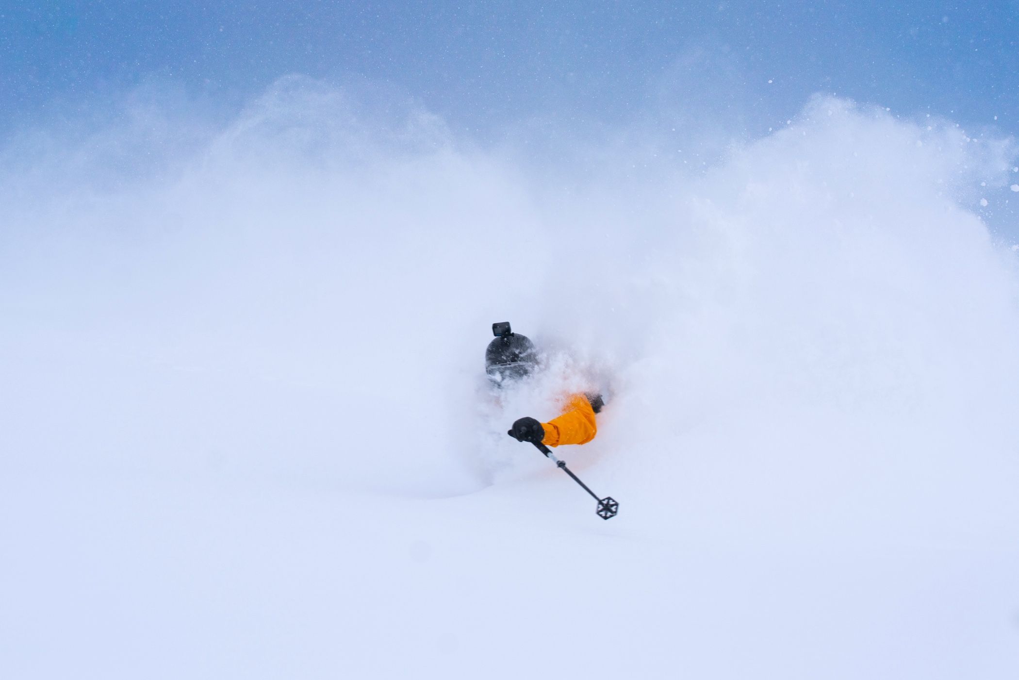 Skier in powder with a helmet-mounted GoPro