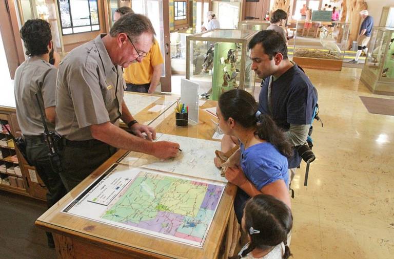 Visitors at an information center in Yellowstone National Park