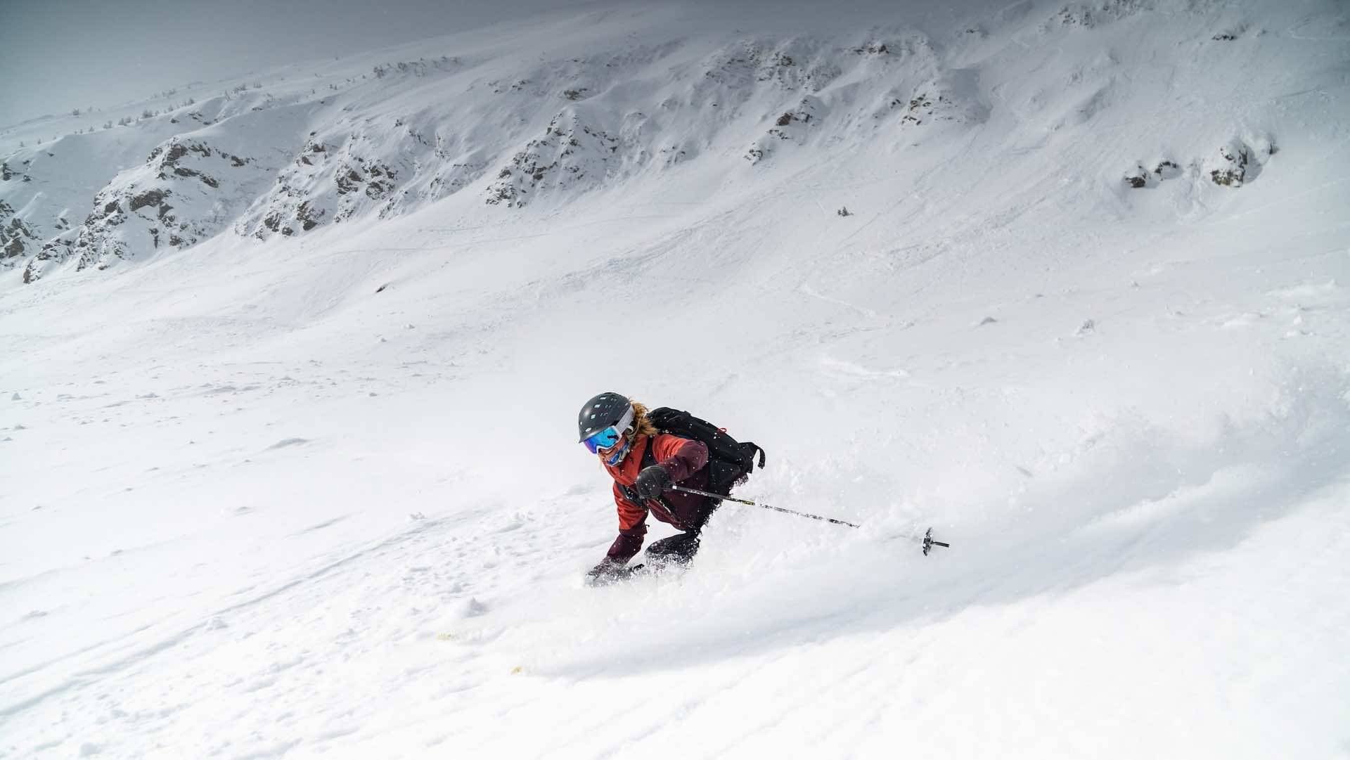 A skier making powder turns in the Bowl