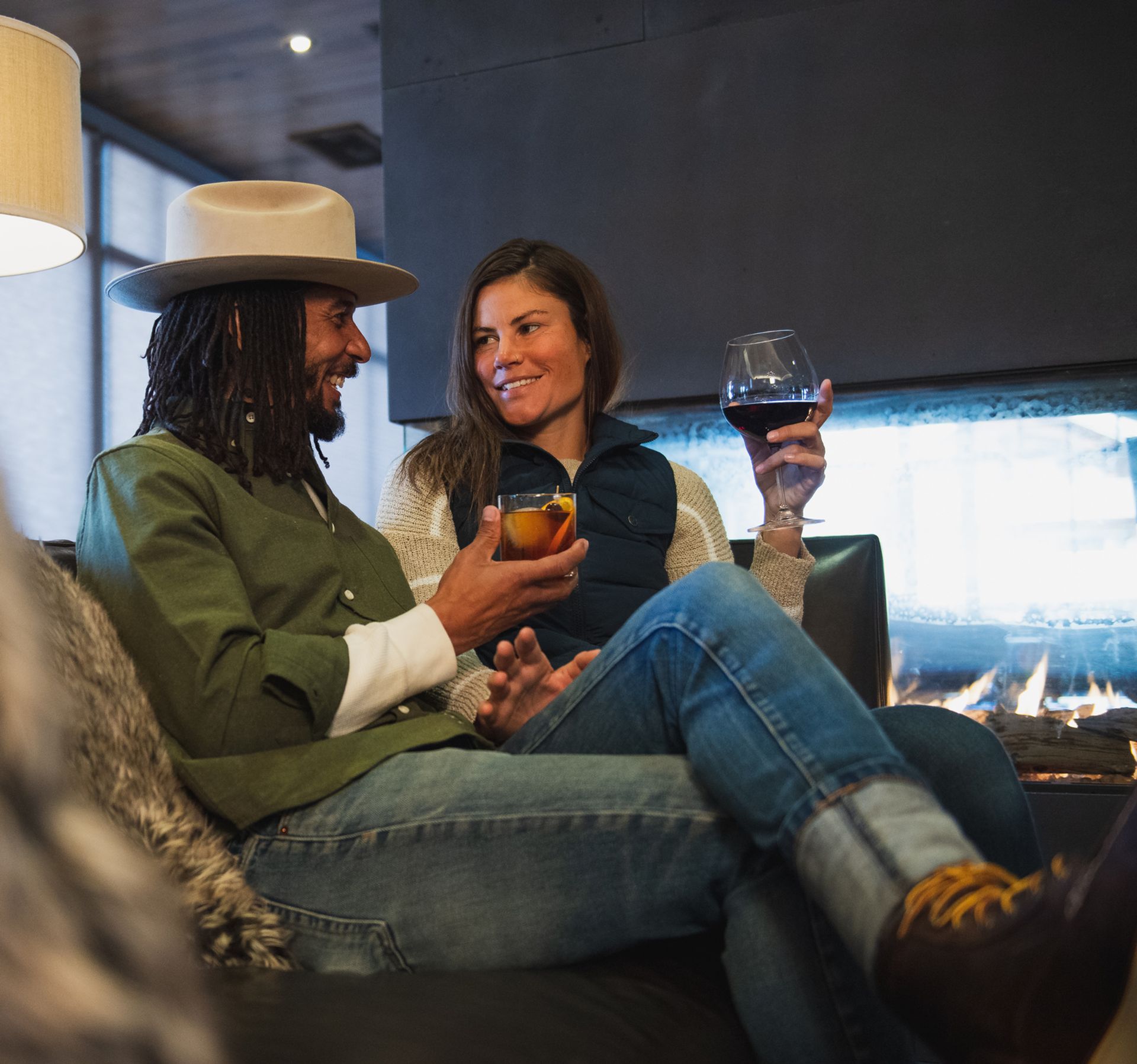 Couple sitting in the Carabiner Lounge with drinks