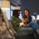 Couple with drinks at the Carabiner Lounge