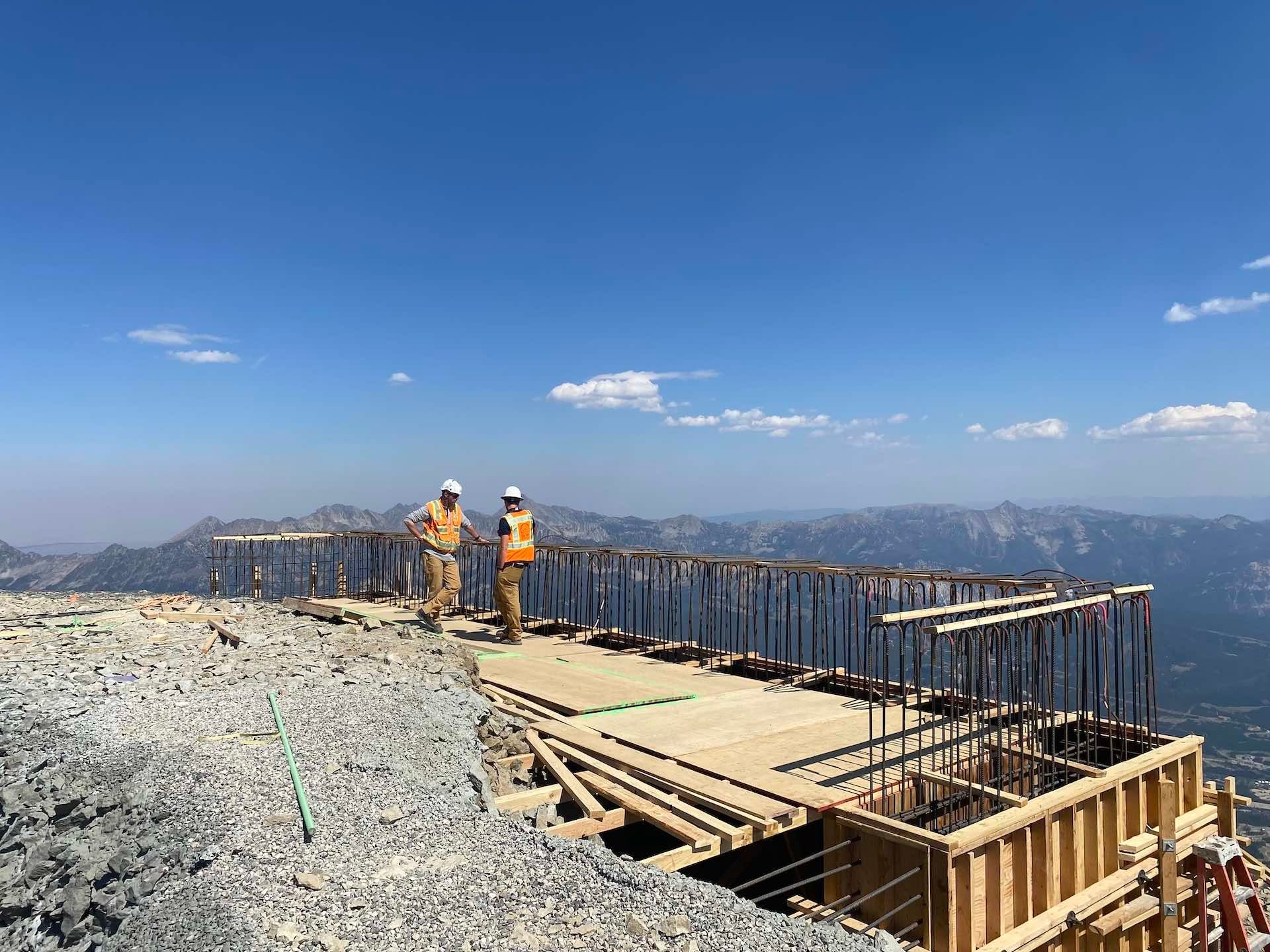 Chad speaking with a construction worker where the new top terminal will be