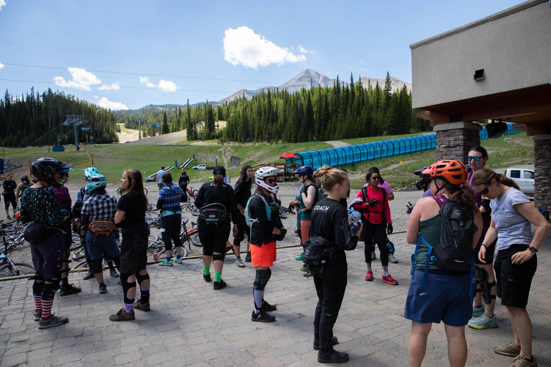 women chat before bike clinic starts