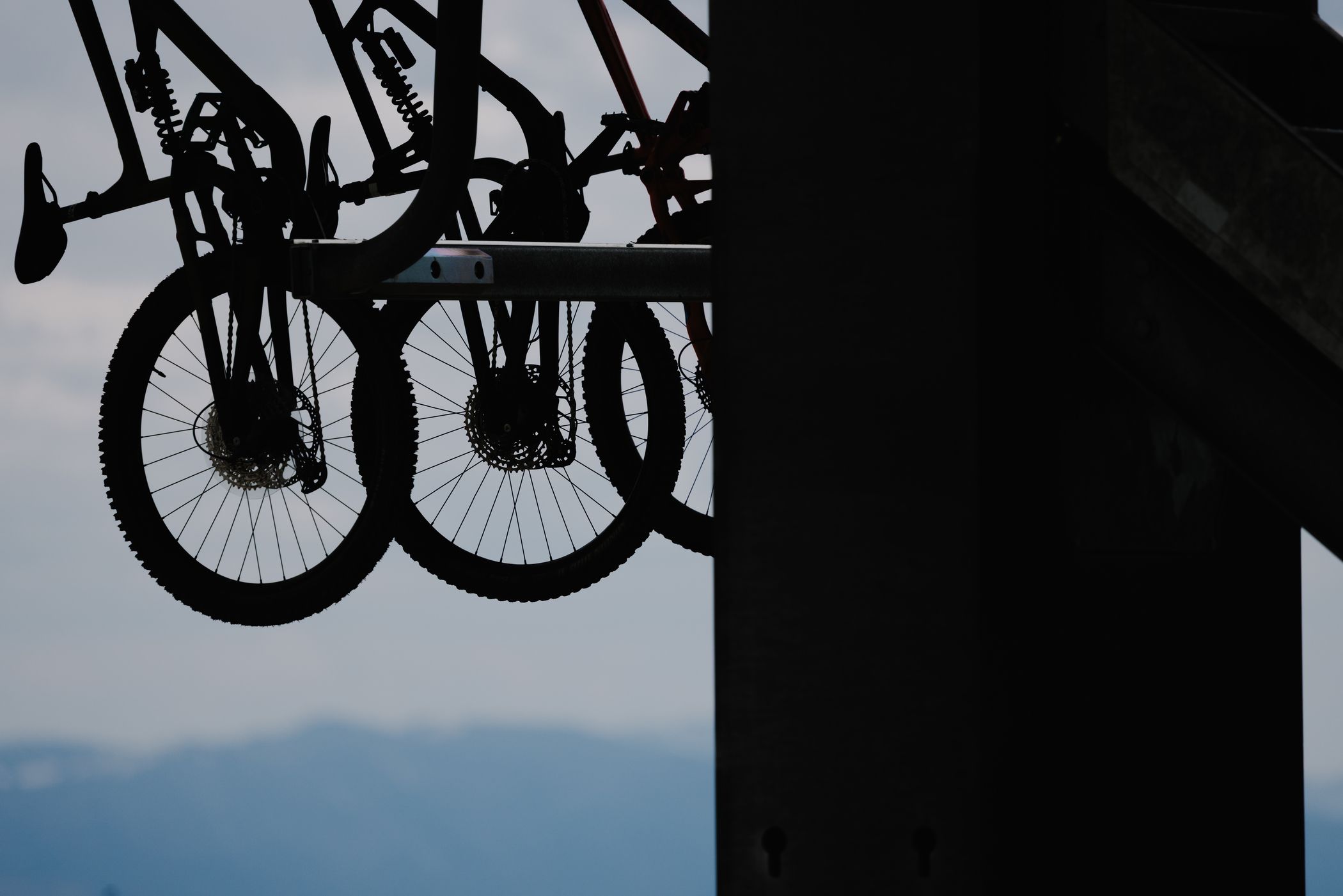Bikes hanging from a chairlift bike carrier