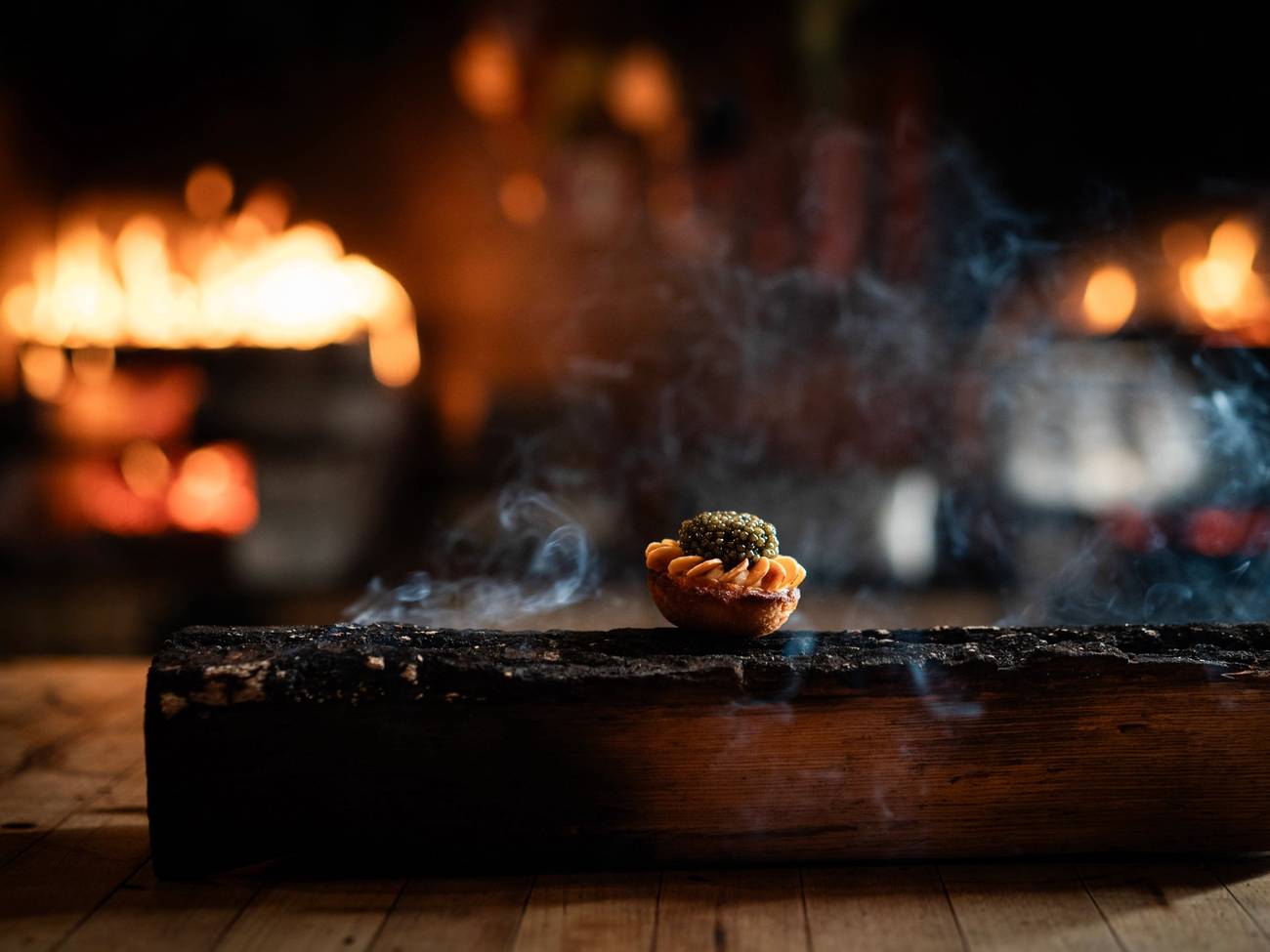 Food prepared on a smoldering log