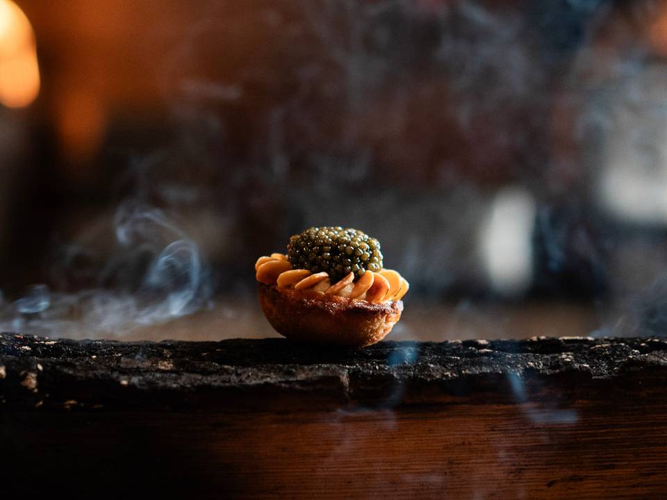 Food prepared on a smoldering log