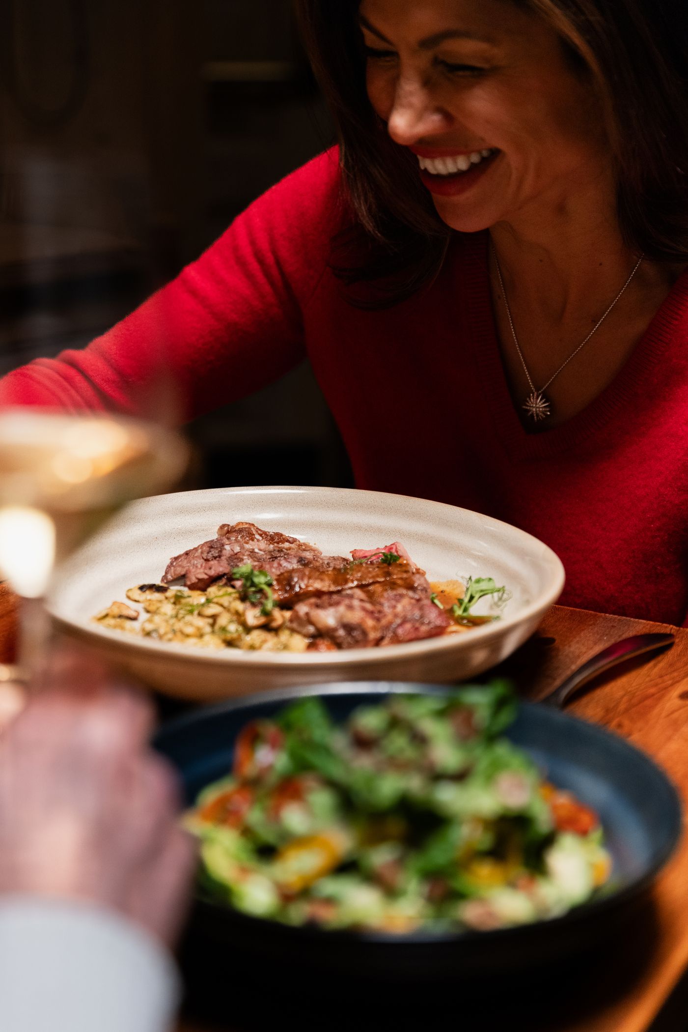 Woman smiling with plated dishes