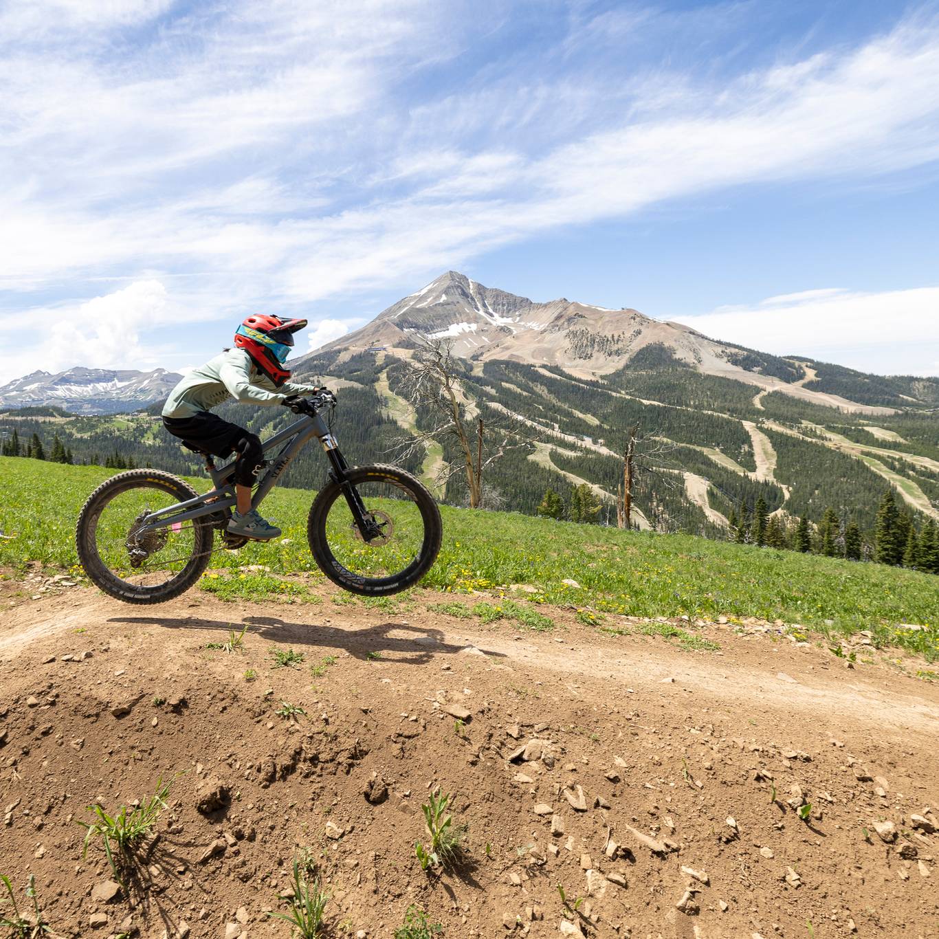 Girl jumping on a mountain bike