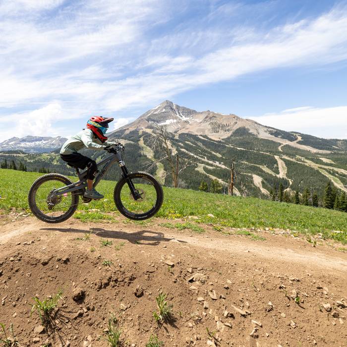 Child jumping on a mountain bike