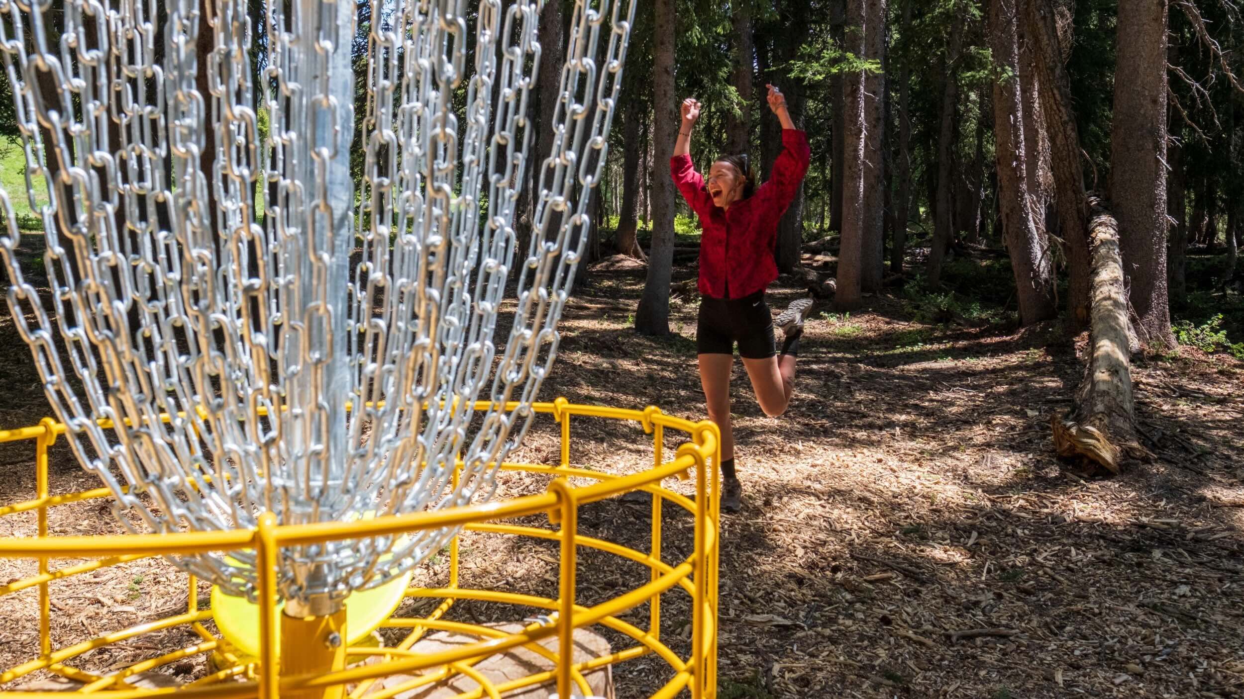 Playing disc golf at Brighton Resort in the summer