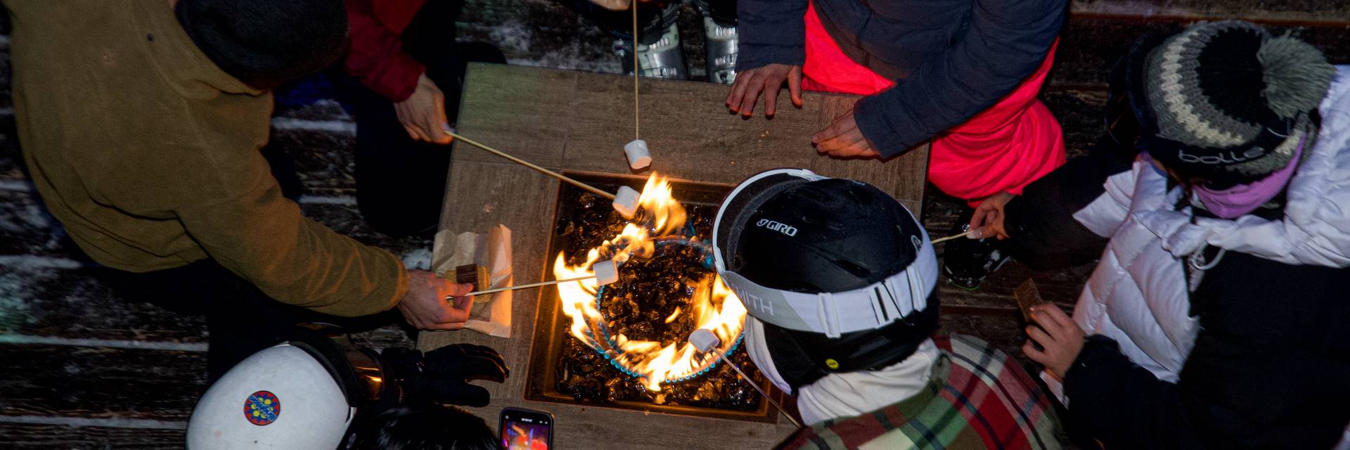Roasting marshmallows on the Alpine Rose Deck at Brighton Resort