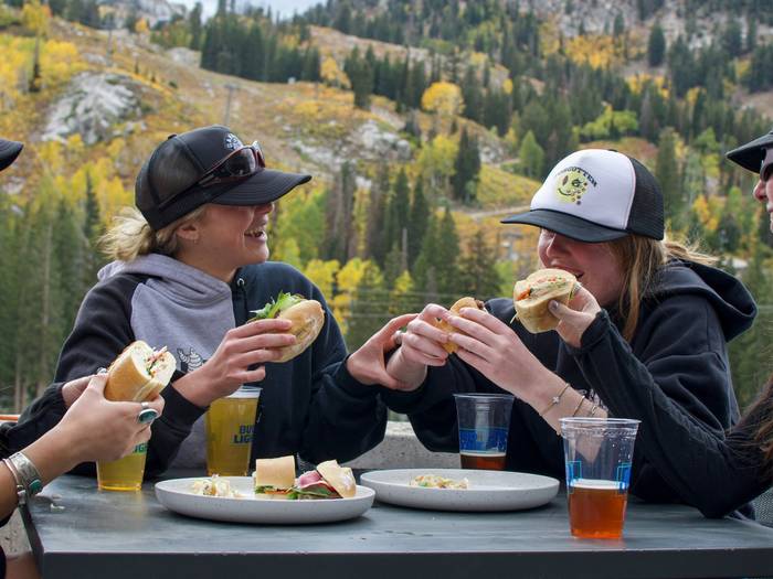 Friends eating at Not Oktoberfest at Brighton Resort in the summer