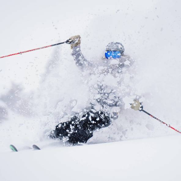 Skier in deep powder slash at Brighton Resort