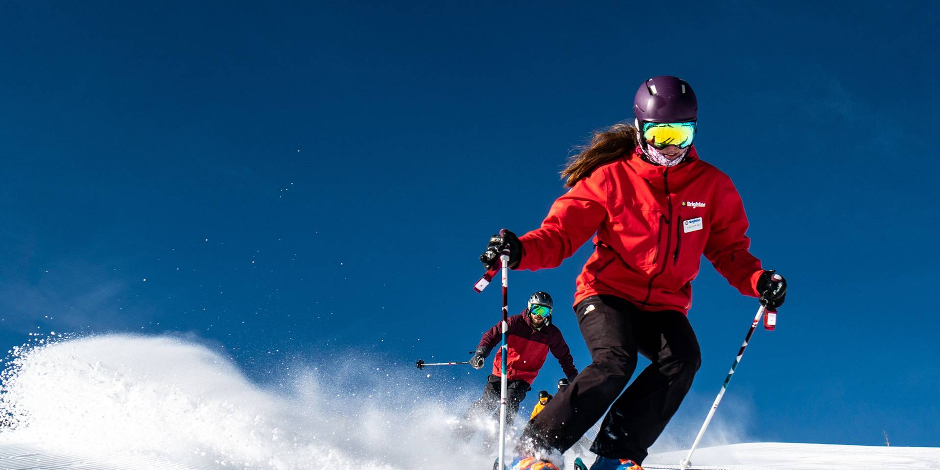 Ski school instructor on a groomer