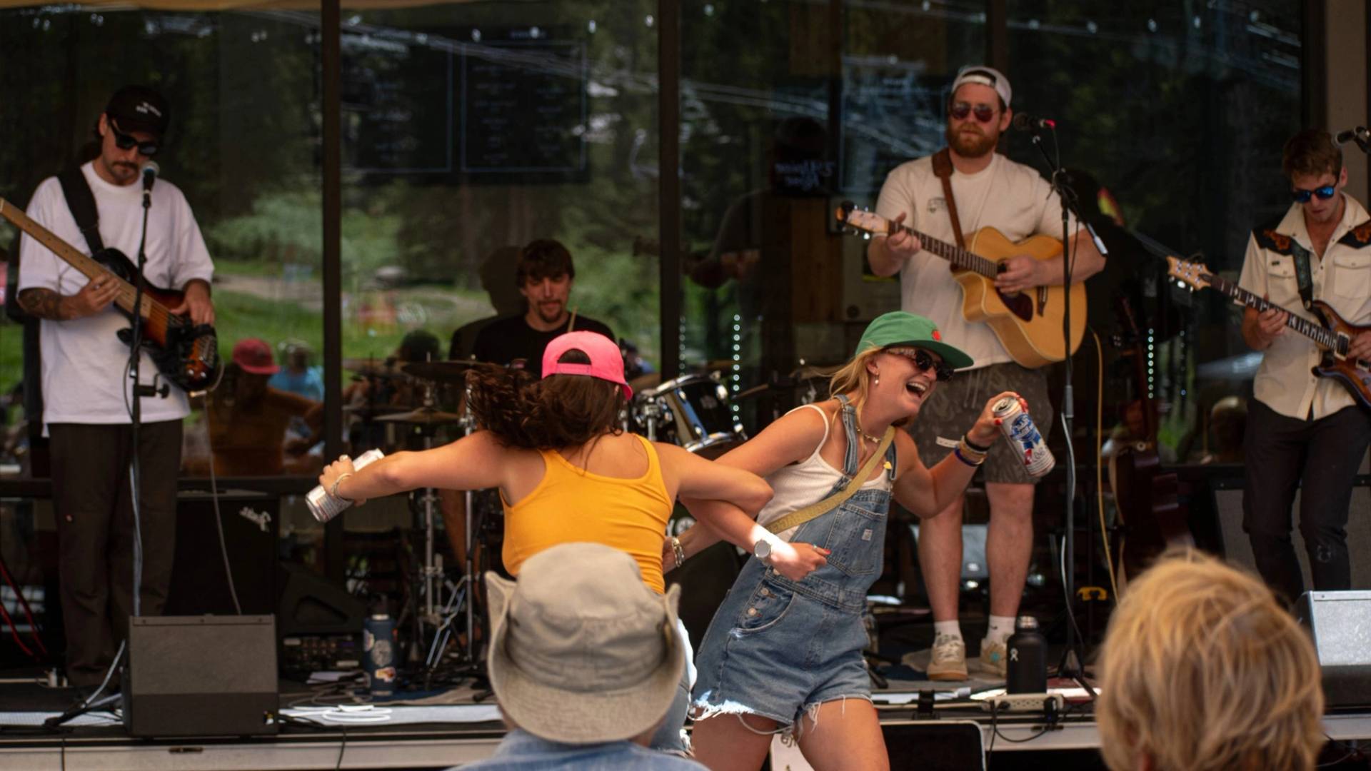 Friends dancing at the Alpine Rose weekend BBQ at Brighton Resort