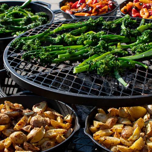 Cooking on the grill at campfire cookouts at Brighton Resort