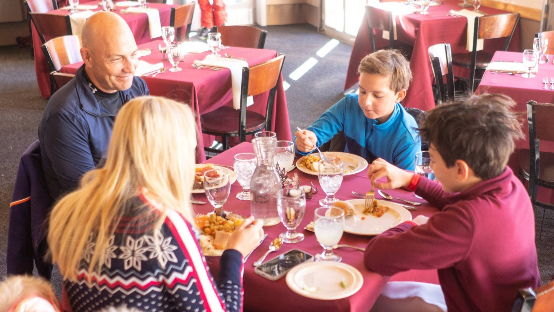 Family eating Thanksgiving dinner at the Milly Chalet in Brighton Utah