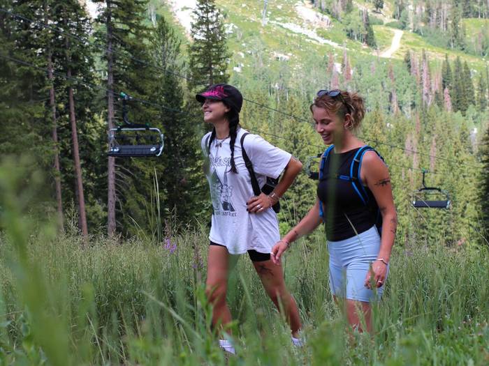 Friends hiking together during the summer at Brighton Resort